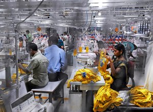 Garment worker at Century Apparels produces clothing for export, Tamil Nadu, India